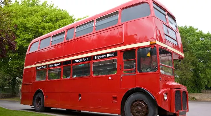 An old bright red double decker bus from England