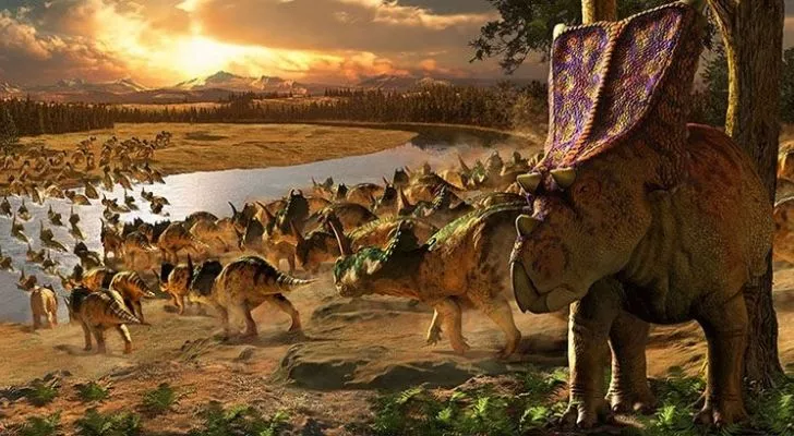 A large herd of dinosaurs travelling together